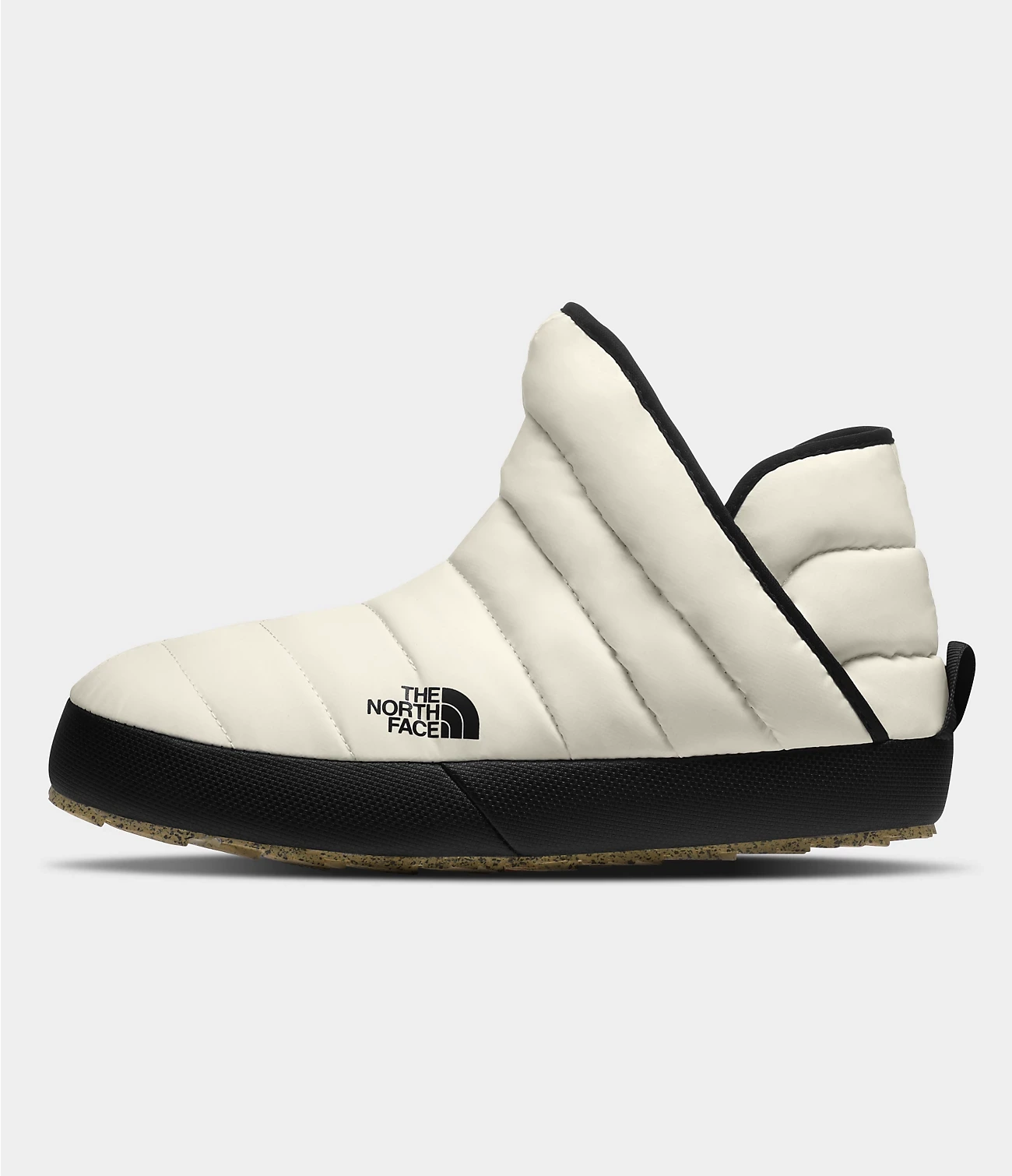 Cream quilted camp boot with a black sole and The North Face logo.