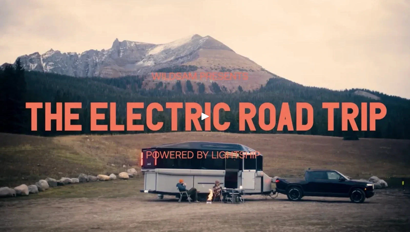 The Electric Road Trip film poster showing a Lightship trailer and tow vehicle in a mountain landscape.