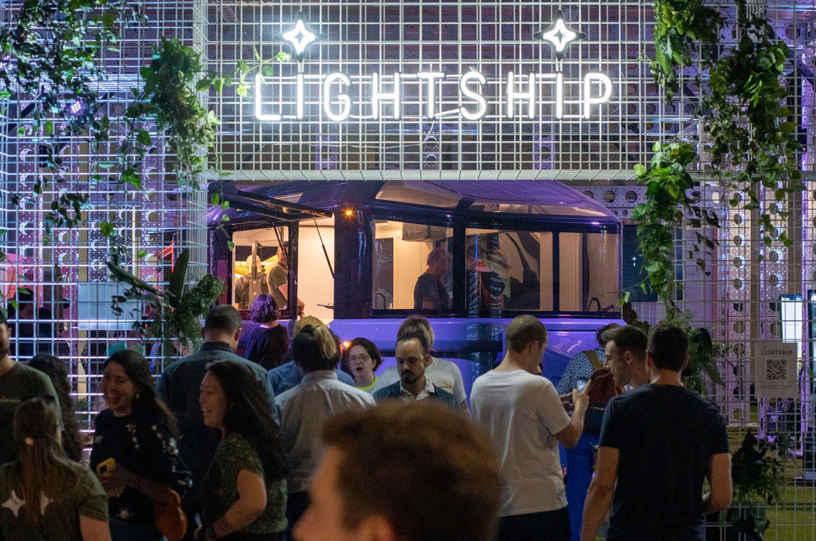 Crowd gathered around the Lightship L1 prototype beneath the illuminated Lightship wordmark at SXSW 2023.