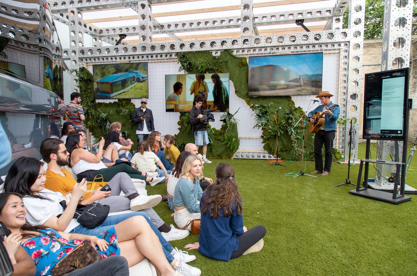 Audience inside the Lightship SXSW environment during live programming with the prototype and brand media surrounding the space.