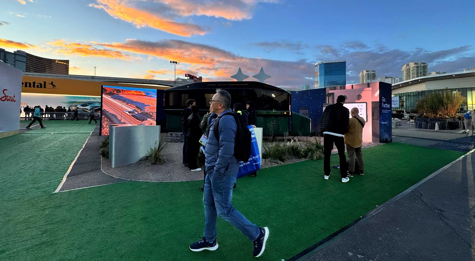 Lightship CES activation at sunset with the trailer, display walls and visitors exploring the installation.