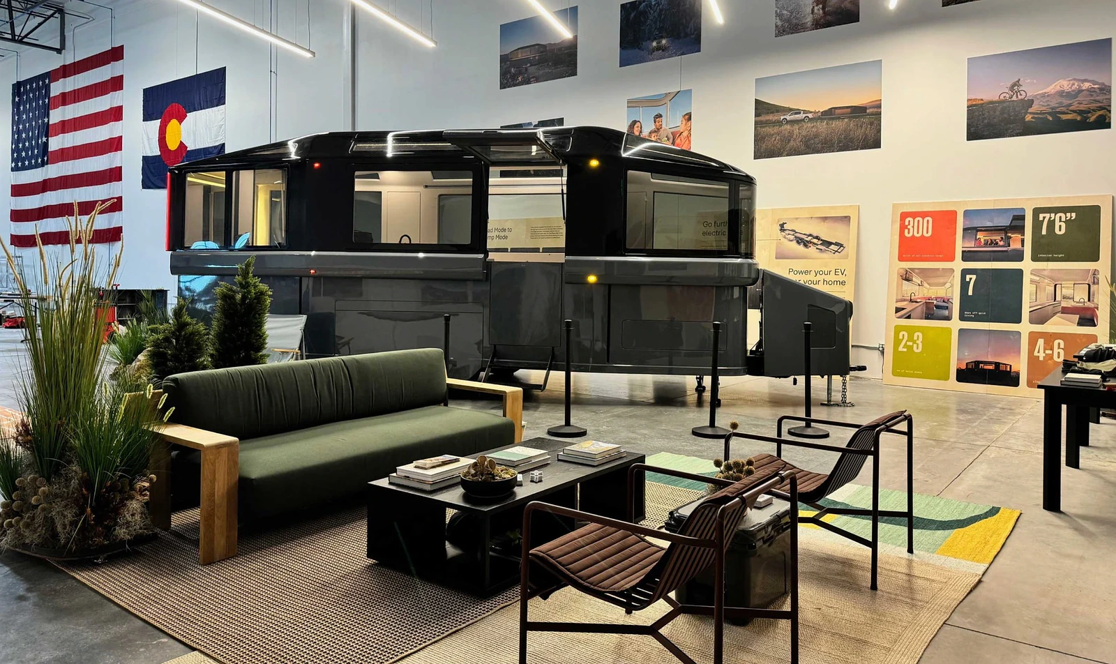 Lightship showroom interior with the trailer displayed inside a furnished brand environment.