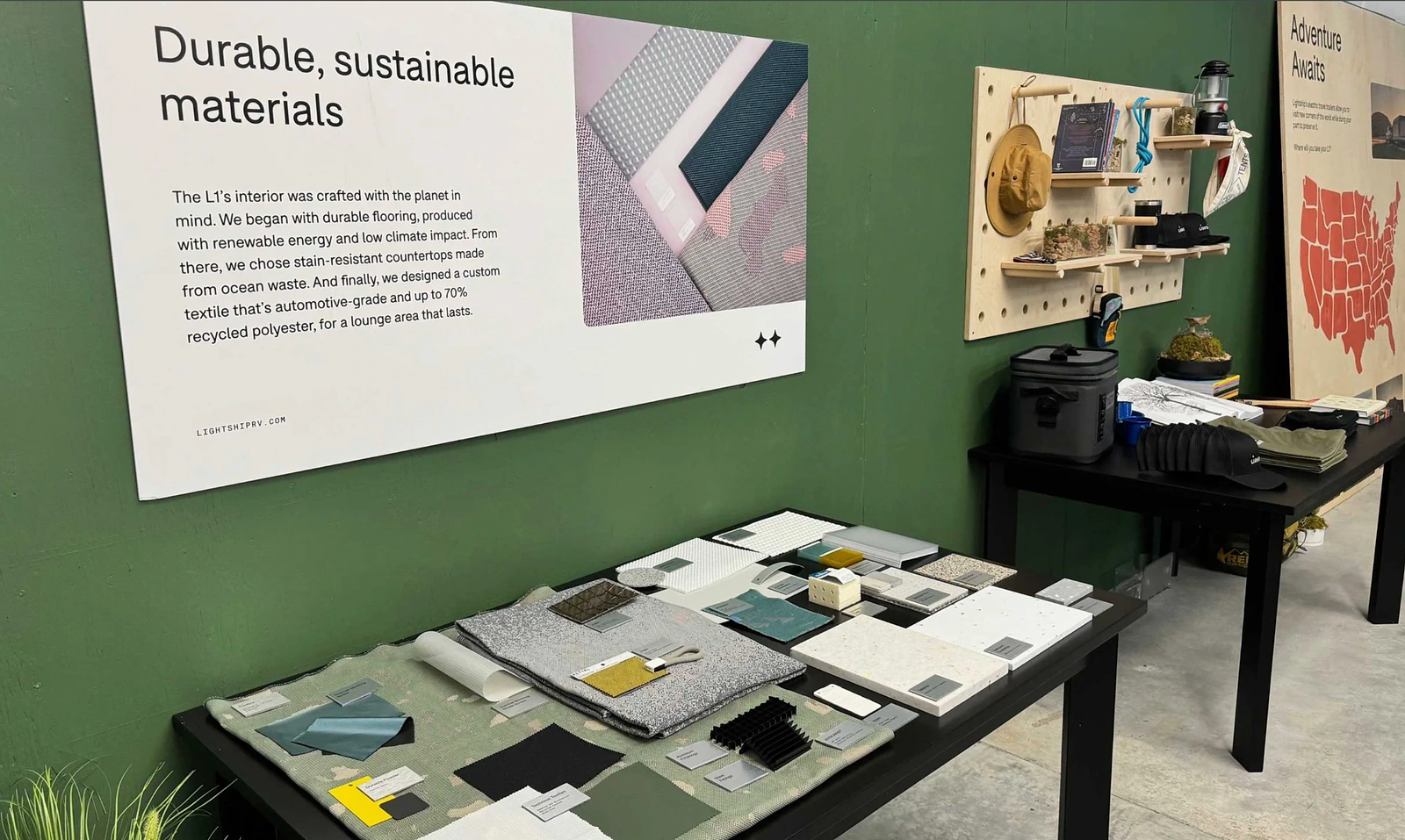 Display of sustainable interior materials and branded product storytelling inside the Lightship showroom.