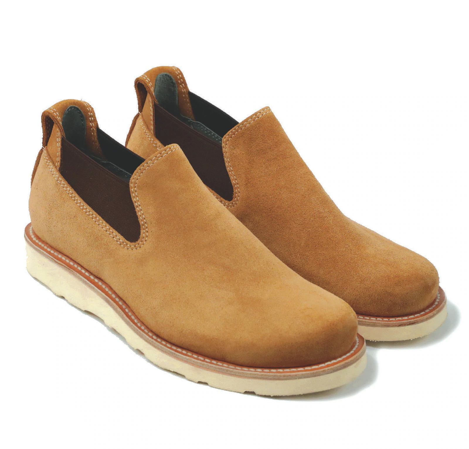 Pair of tan suede Terrascout slip-on shoes on a white background.