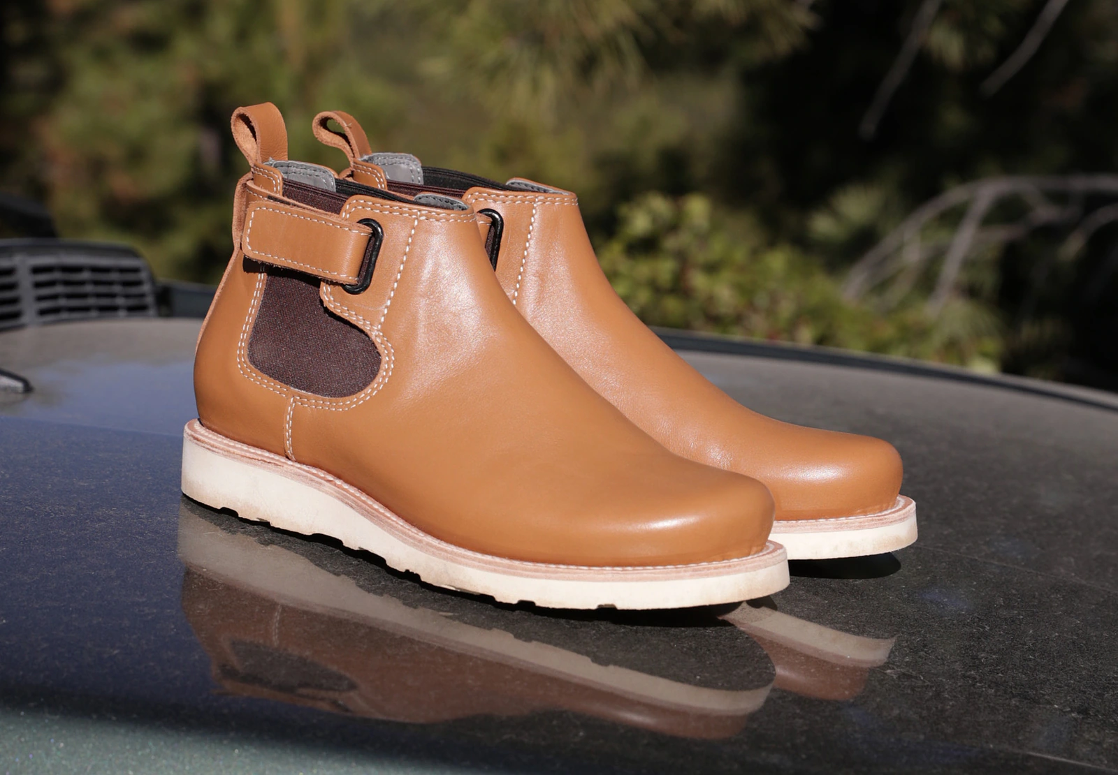 Pair of tan leather Terrascout ankle boots photographed outdoors.