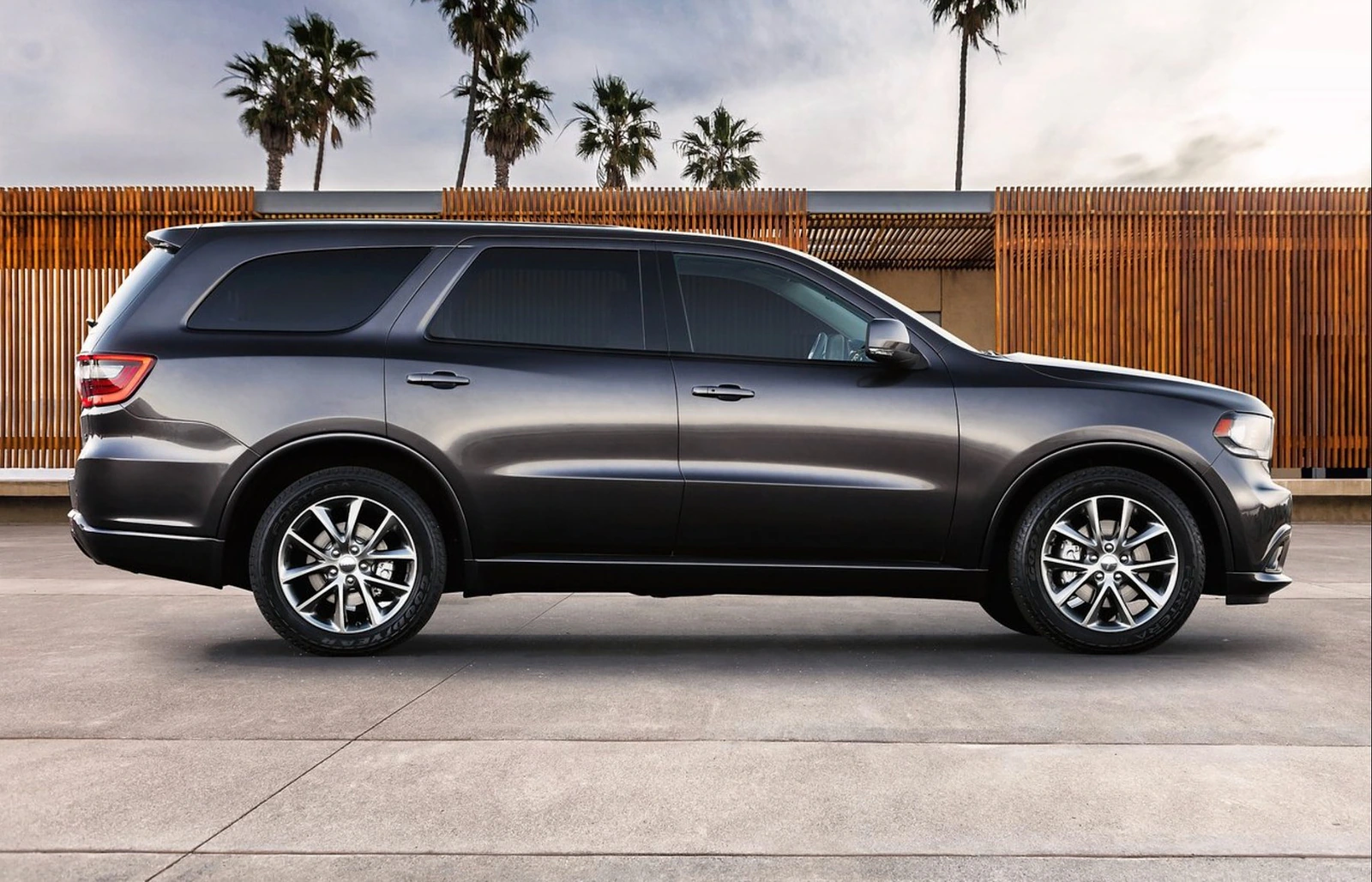 Side profile of the 2011 Dodge Durango in a modern architectural setting.