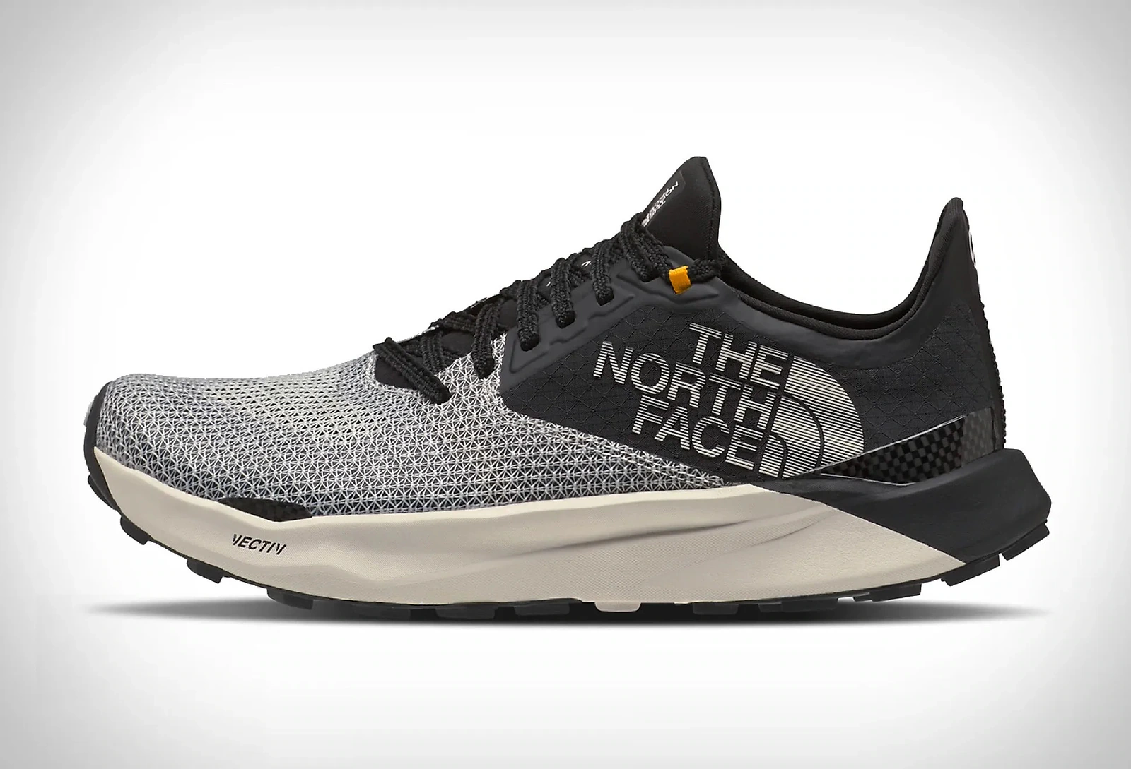 Black and white The North Face VECTIV performance shoe shown in side profile.
