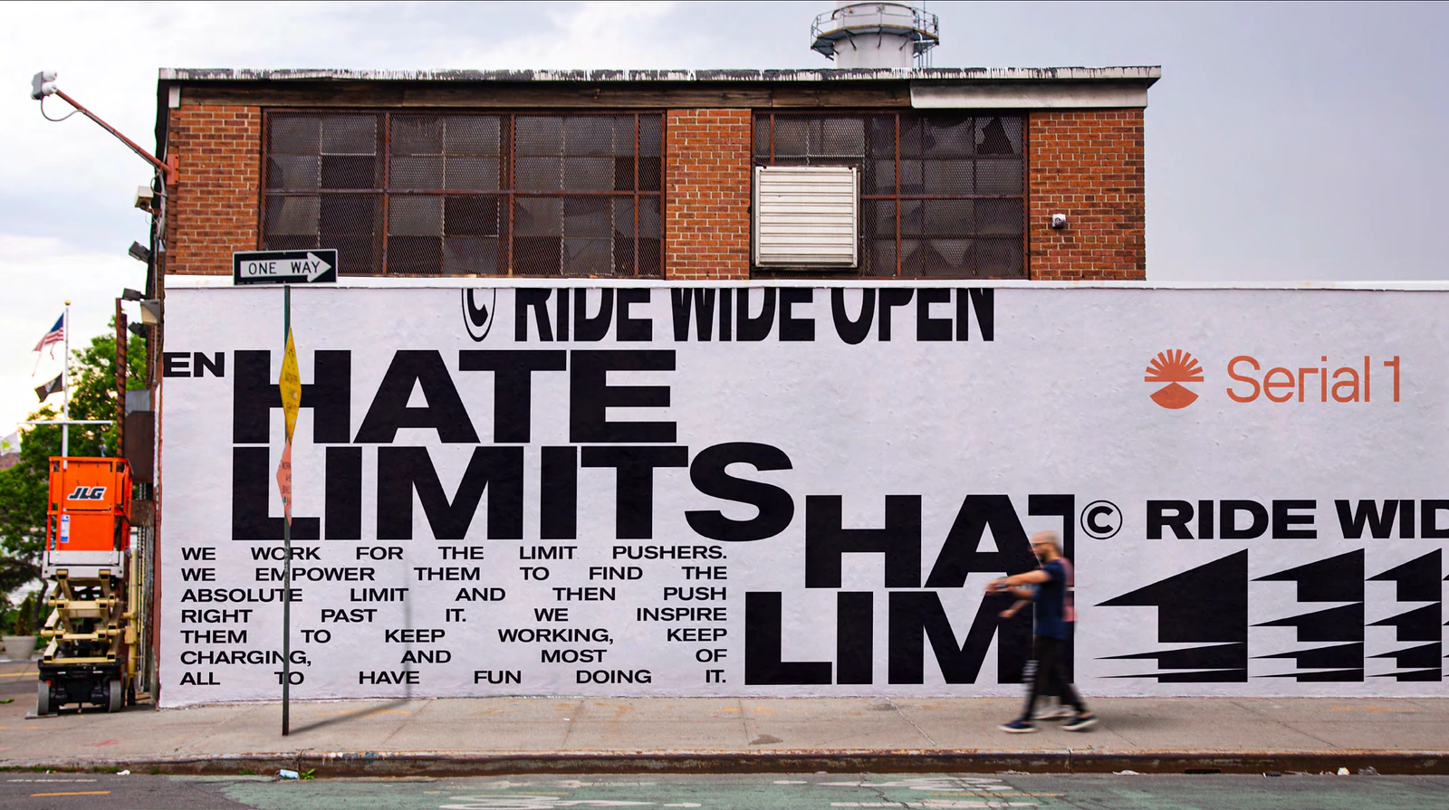 Serial 1 mural-style brand application on a large exterior wall using Ride Wide Open language and bold black typography.