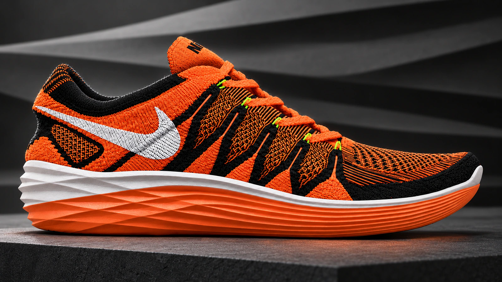 Orange and black Flyknit Lunar 2 with a layered Lunar midsole.